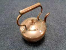 An antique copper kettle