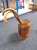 A stick pot containing two walking sticks