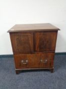 A Victorian inlaid mahogany commode chest