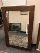 A modern brown framed mirror 86 x 130 cm