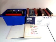 Two boxes containing a large quantity of world stamps in folders and albums