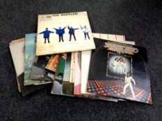 A quantity of vinyl LPs to include The Beatles, Beach Boys, Wings,