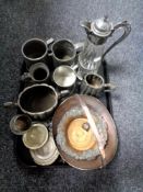 A tray of assorted metal ware to include pewter and cut glass claret jug, tankards, tea ware,