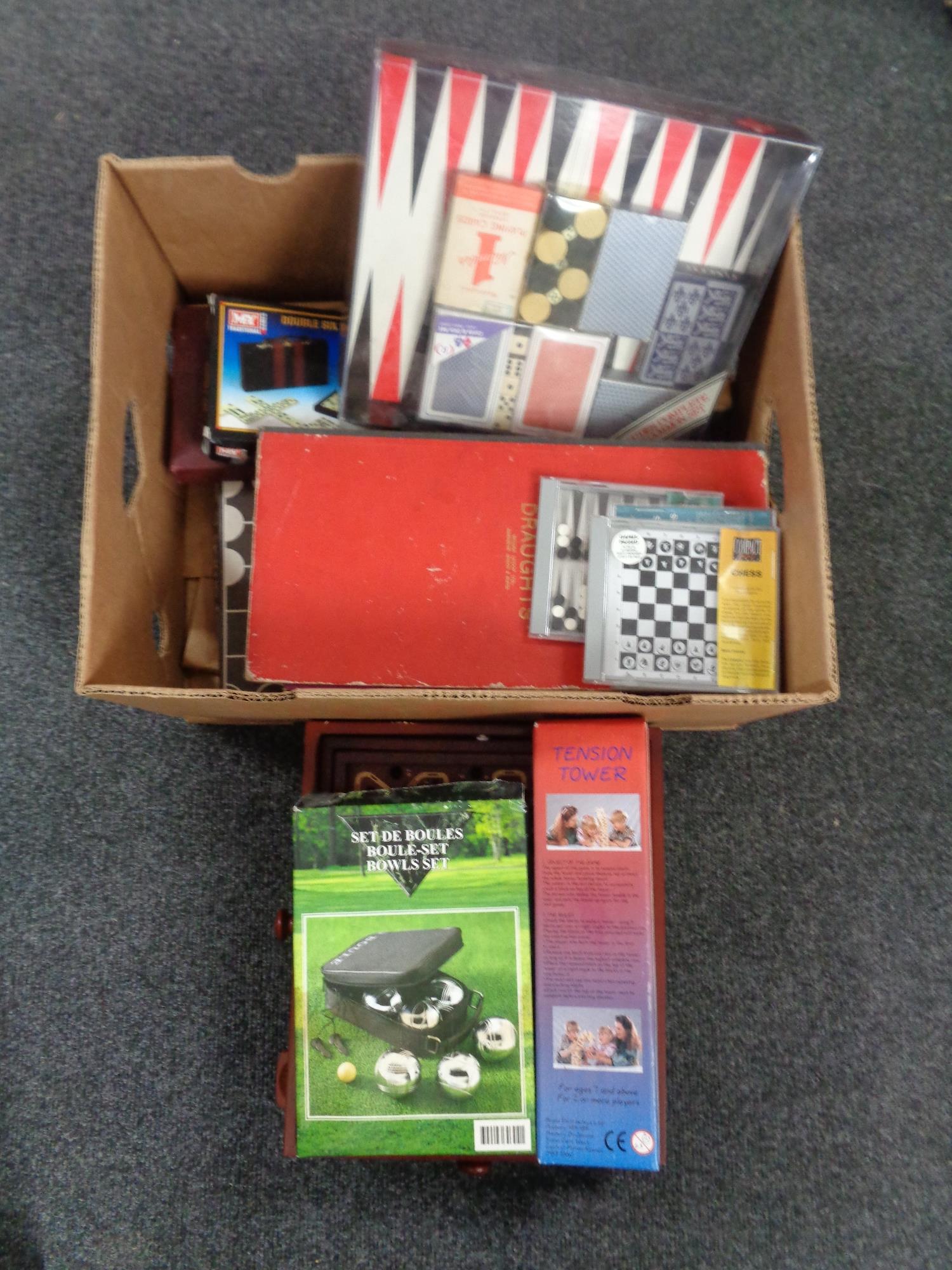 A box containing a quantity of games to include games compendiums, draughts, Plinko pinball,
