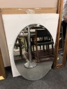 A contemporary oval mirror 61 x 89 cm