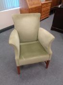A 20th century green dralon upholstered armchair