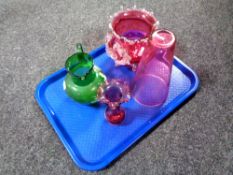 A tray containing four pieces of antique glassware to include a hand painted green glass jug,
