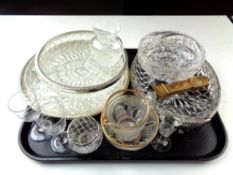 A tray containing assorted glassware together with a brass ornament of a grandfather clock