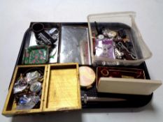 A tray containing assorted wristwatches, costume jewellery, pin badges relating to Newcastle United,