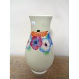 A Newport pottery Clarice Cliff vase decorative with flowers,