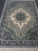 A machined Persian design rug,