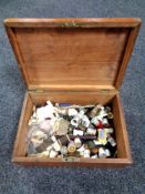 An antique pine box containing sewing accessories to include threads,