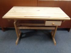 A pine adjustable computer desk