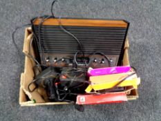 A box containing Atari 2600 video computer system with leads and controllers together with four