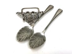 A pair of Victorian silver jam spoons and an ornate silver menu stand (3)