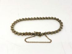 A 14ct gold diamond set bracelet, 8.6g, length approximately 22 cm.