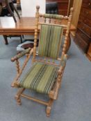 An American style rocking chair upholstered in a green striped fabric