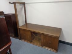 A 20th century continental oak triple door sideboard on stand (as found)