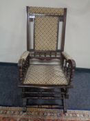 An Edwardian mahogany American style rocking chair