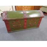 A 19th century painted dome topped shipping trunk with metal mounts