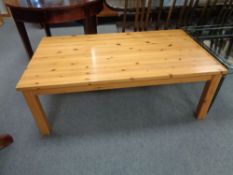 A rectangular pine coffee table