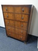 A 20th century walnut five drawer chest