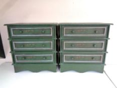 Two contemporary painted three drawer chests together with a painted wooden caddy