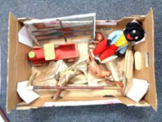 A box containing miscellaneous to include a mid 20th century child's wooden train, golly cloth doll,