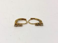 A pair of 10ct gold diamond set earrings CONDITION REPORT: 0.7g.