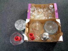 Two boxes containing a large quantity of glassware to include hurricane lamps, kitchen bowls, vases,