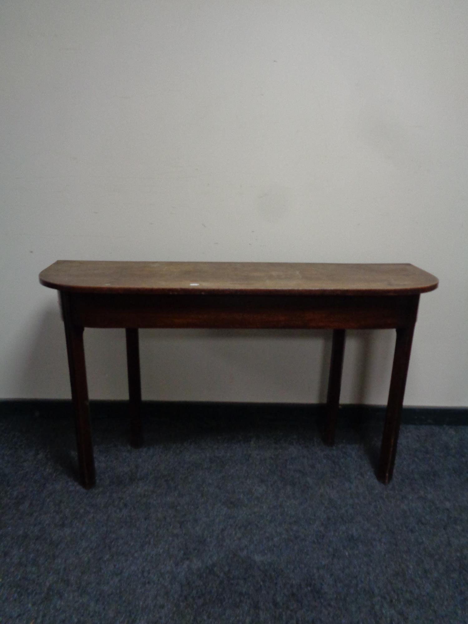 A 19th century mahogany D-shaped side table