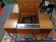 An HMV stereo master in teak cabinet