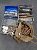 A canvas bag of three tool boxes containing assorted hand tools