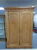 A Victorian satinwood double door wardrobe, fitted internal trays and drawers (as found).