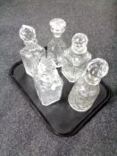 A tray containing five cut glass lead crystal decanters.