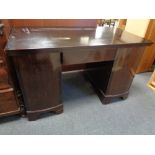 A 20th century twin pedestal desk fitted a drawer
