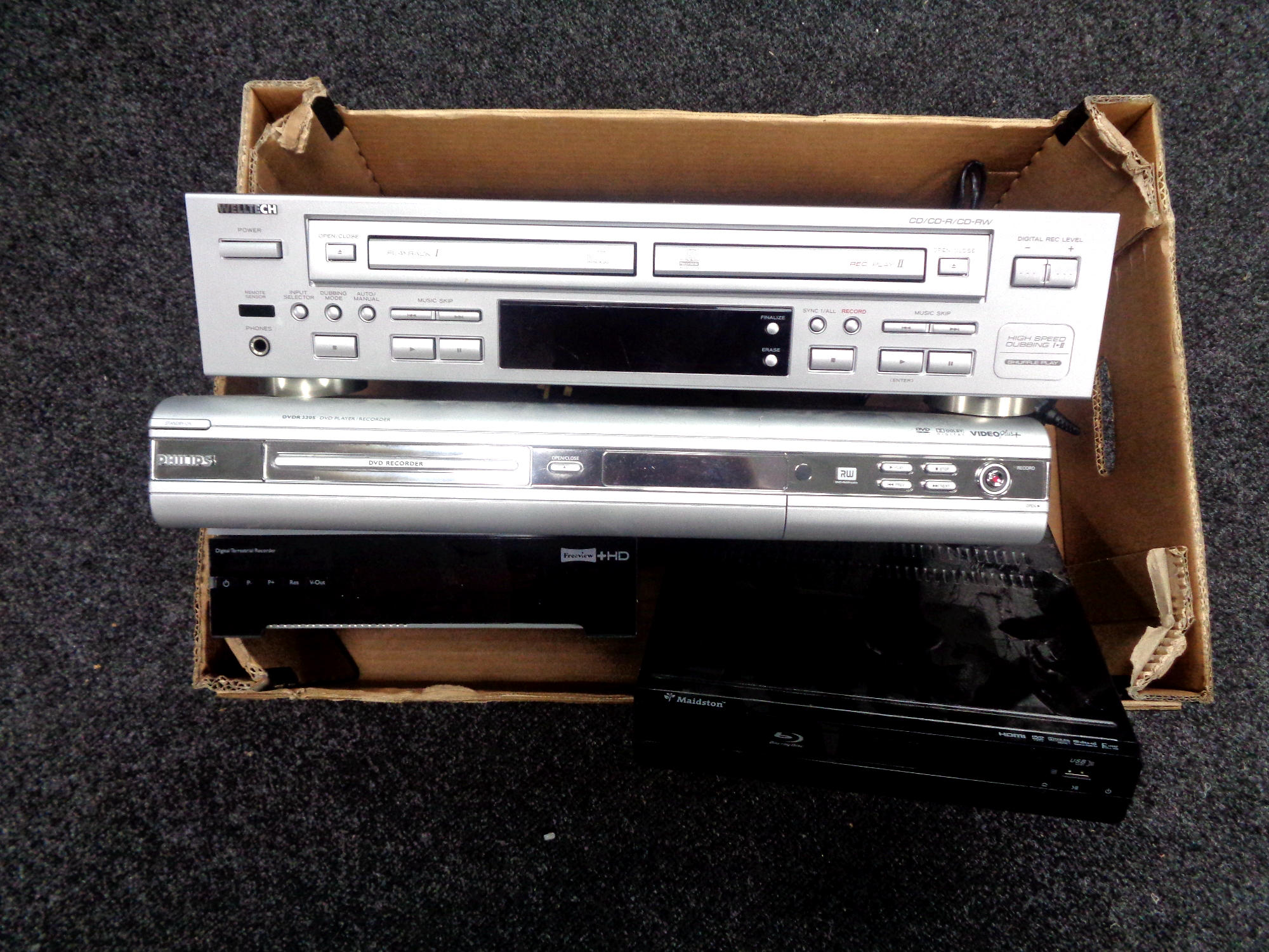 A box of Welltech CD twin deck recorder, Phillips DVD recorder, Freeview box,