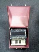 A cased Hohner Student II accordion