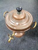 An antique brass and copper Samovar.