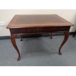 An antique mahogany centre table on cabriole legs