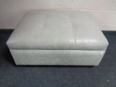 A contemporary oversized footstool