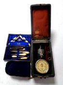 A tray containing cased vintage rev meter, cased manicure set,