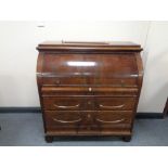 A 19th century mahogany cylinder bureau fitted four drawers