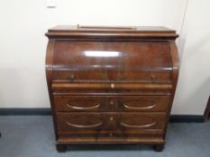 A 19th century mahogany cylinder bureau fitted four drawers