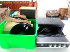 A mid 20th century HMV tabletop electric record player together with a crate containing 78s