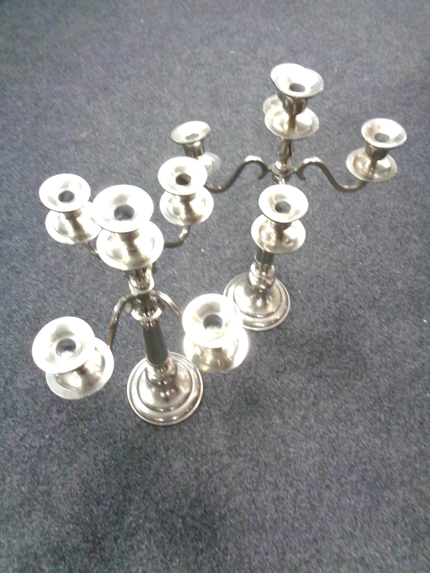 Two metal table candelabra, height 62.