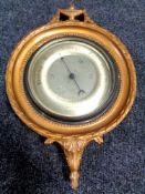 An early 20th century Gomme Furniture of Whickham barometer with silver dial in a gilt frame