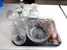 A tray containing assorted glassware to include four assorted decanters with stoppers,