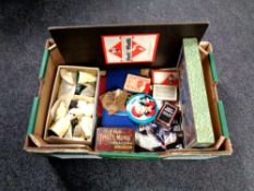 A box containing board games, chess sets, chess boards,