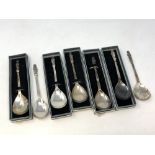 A collection of seven silver apostle spoons each showing a different saint (five boxed)